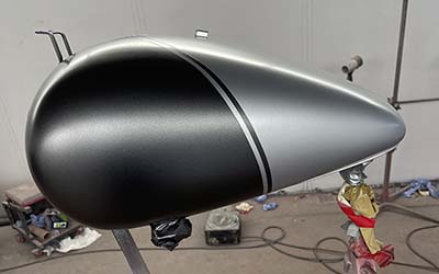 Bopper motorcycle in for Shorter rear mudguard and fresh tank painted two new colours and matte lacquered.