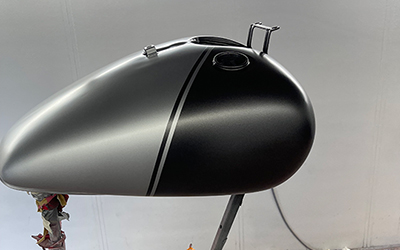 Bopper motorcycle in for Shorter rear mudguard and fresh tank painted two new colours and matte lacquered.