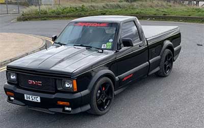 GMC Syclone all the plastic cladding repainted in matte black.